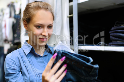 Young girl buying clothes