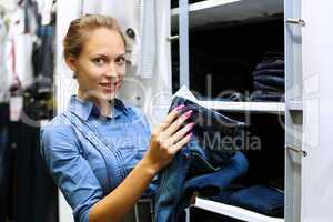 Young girl buying clothes