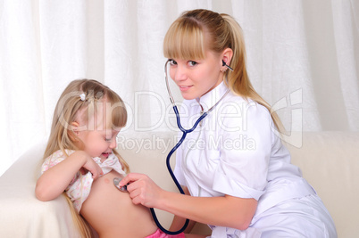 doctor listens to a stethoscope