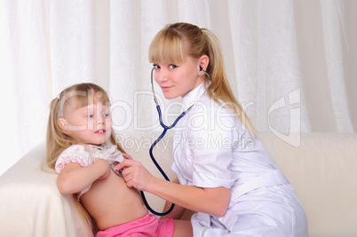 doctor listens to a stethoscope