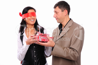 young man gives his girlfriend a gift