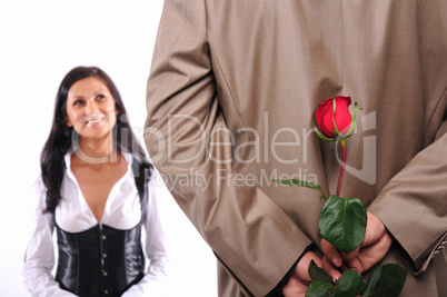 young man gives his girlfriend a rose