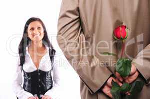 young man gives his girlfriend a rose