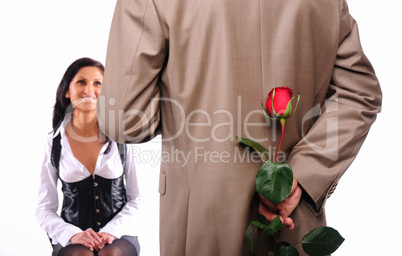 young man gives his girlfriend a rose