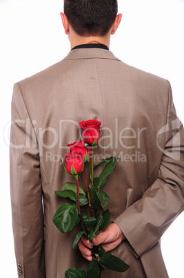 young man hides behind a rose