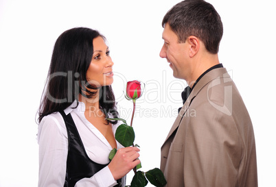 young man gives his girlfriend a rose