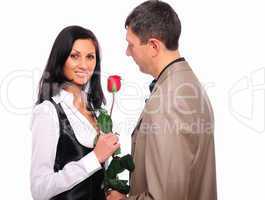young man gives his girlfriend a rose