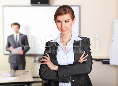 a young business woman in office a young business woman in office