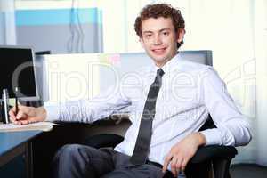 a young businessman in office