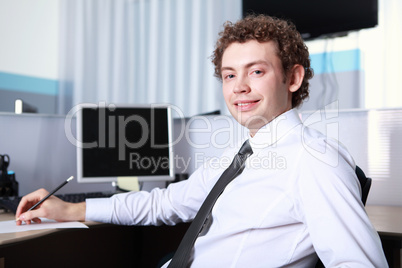 a young businessman in office