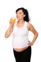 Young pregnant woman drinking orange