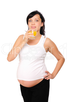 Young pregnant woman drinking orange