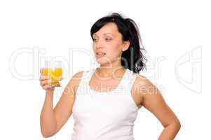 Young pregnant woman drinking orange