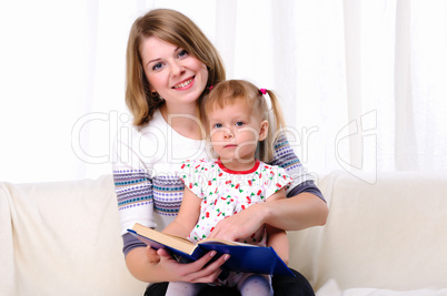 Mother and daughter reading a book