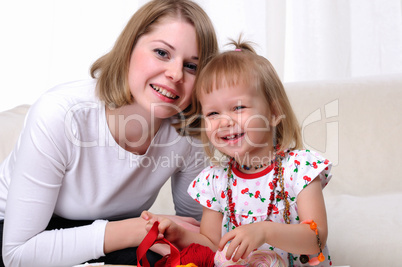 Young mother and her baby daughter