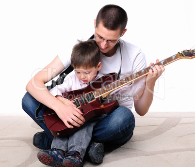 young father teaches his young son