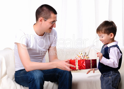 Dad gives his son a gift