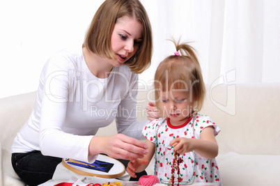 Young mother and her baby daughter Young mother and her baby daughter