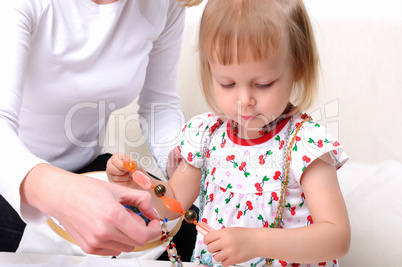 Young mother and her baby daughter