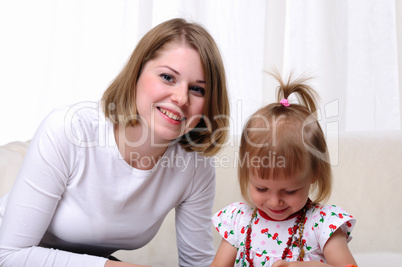 Young mother and her baby daughter