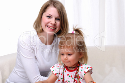 Young mother and her baby daughter