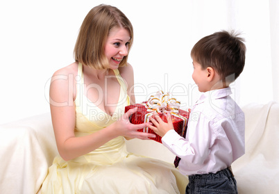 Mom giving a gift to his son