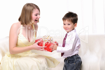 Mom giving a gift to his son