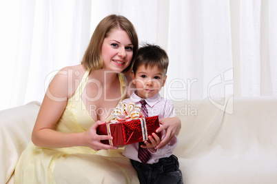 Mom giving a gift to his son