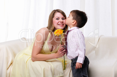 Mom giving a gift to his son