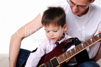 young father teaches his young son