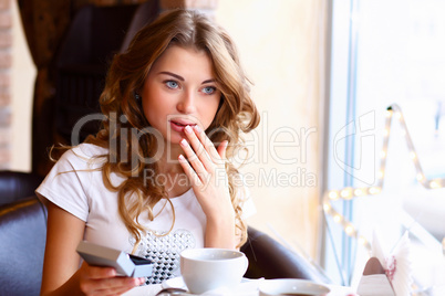 Young couple with engagement ring in a restaurant