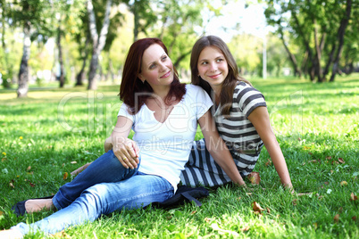 Mother with her daughter in summer park