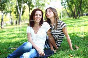 Mother with her daughter in summer park