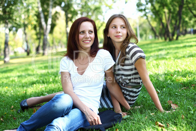 Mother with her daughter in summer park