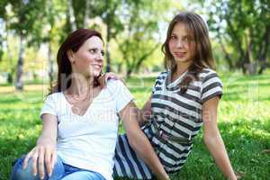 Mother with her daughter in summer park