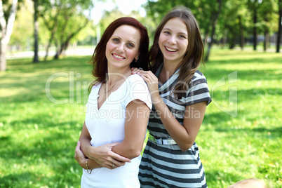 Mother with her daughter in summer park