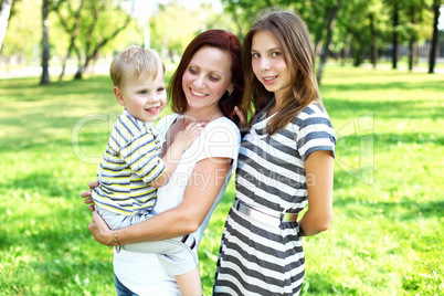 Mother with her daughter in summer park