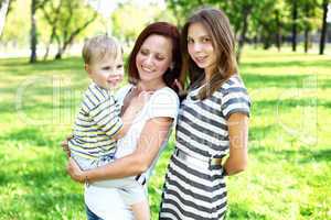 Mother with her daughter in summer park