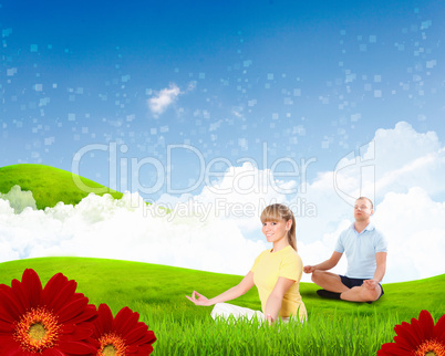 Young woman doing yoga against blue sky