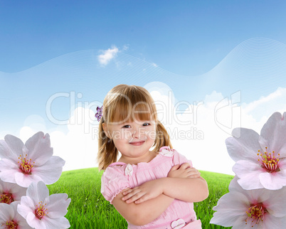 Smiling girl on green grass