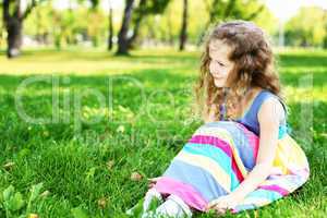 Little girl in summer park