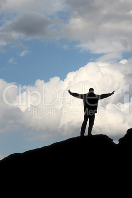 silhouette of a man in front of the blue sky