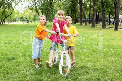 Girls with a bike in the park