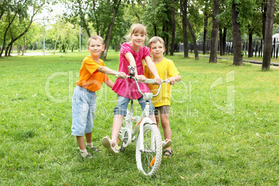 Girls with a bike in the park