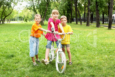 Girls with a bike in the park