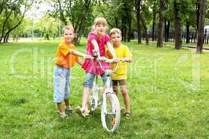 Girls with a bike in the park