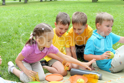 Group of children sitting together in the park