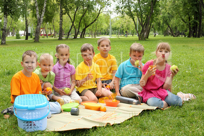 Group of children sitting together in the park