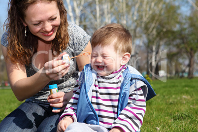 litlle boy with mother in the park