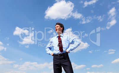 young business man in a blue shirt and red tie